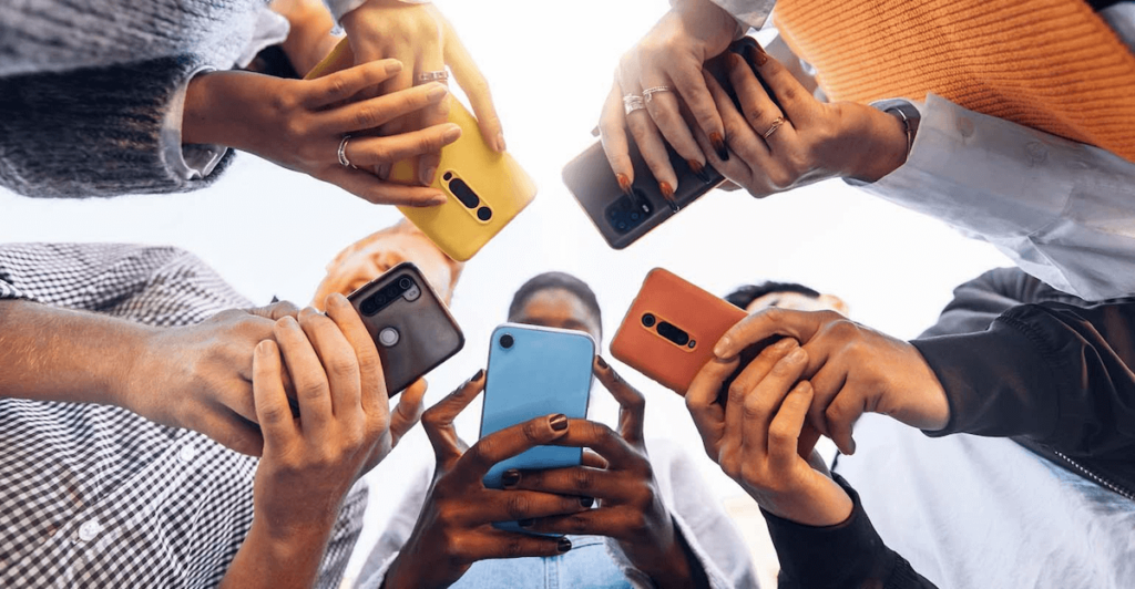 A group of young people on their phones